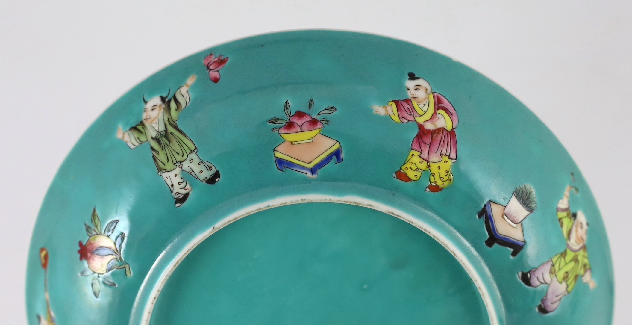 A Chinese turquoise ground 'Boys' dish, Jiaqing seal mark but Republic period, 23.5cm diameter, two hairline cracks